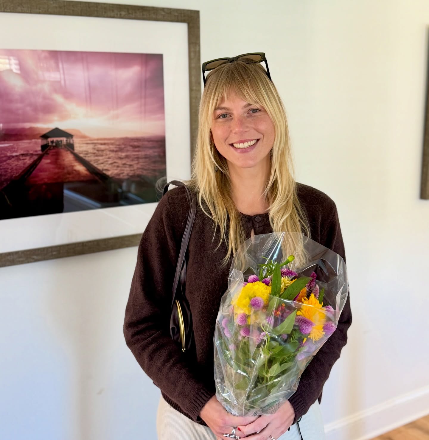 Jersey Shore Acupuncture team member holding flowers