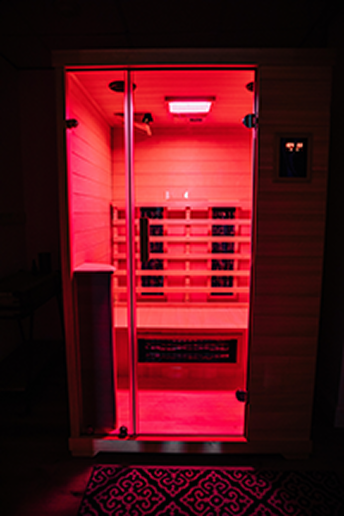 Infrared sauna illuminated with red chromotherapy light